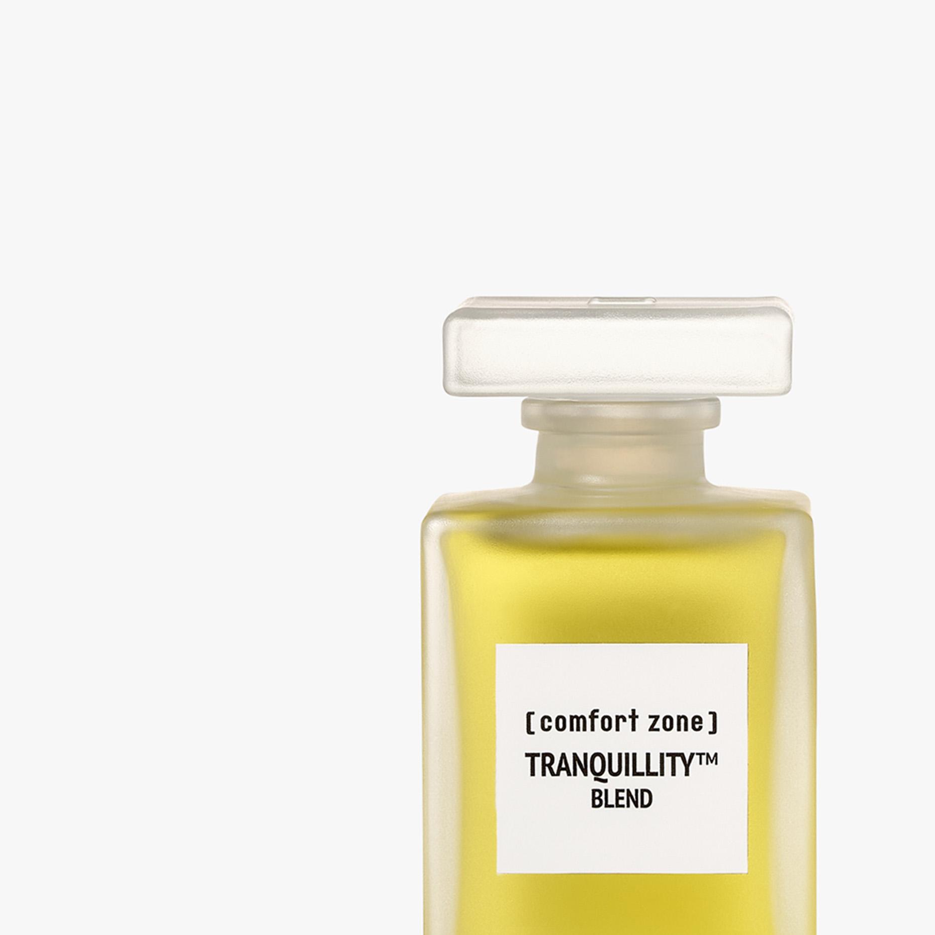 Frosted glass bottle with yellow liquid. Label reads '[comfort zone] TRANQUILLITY™ BLEND'. | [comfort zone] TRANQUILLITY™M BLEND